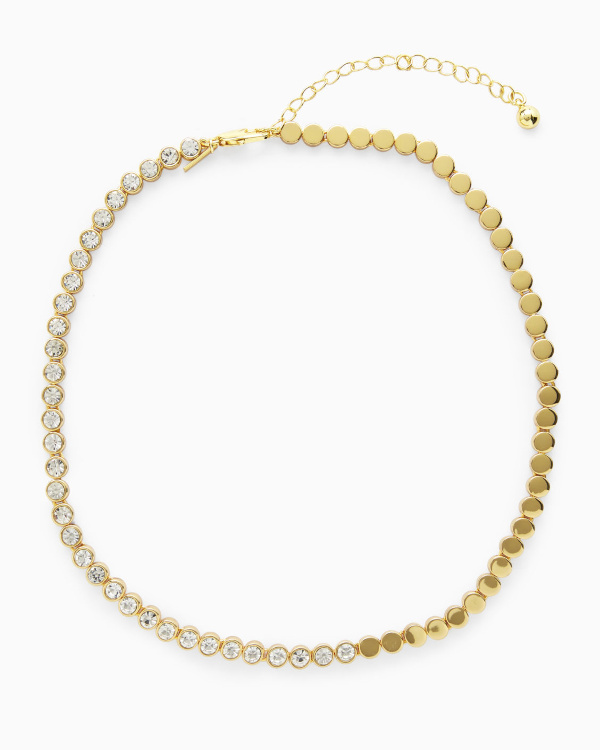 Collier doré composé de petits disques et de cristaux transparents